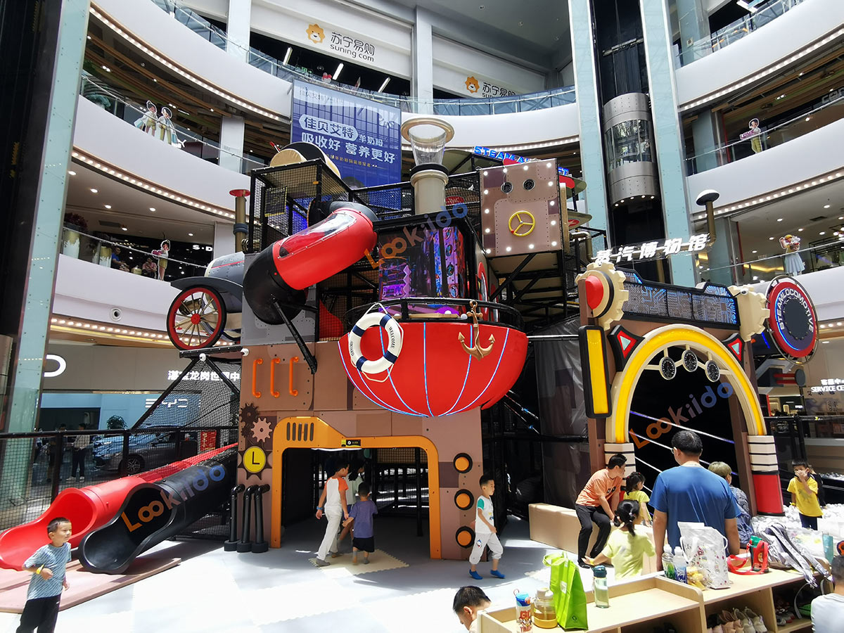 Real shot of retro steam train-shaped soft play playground