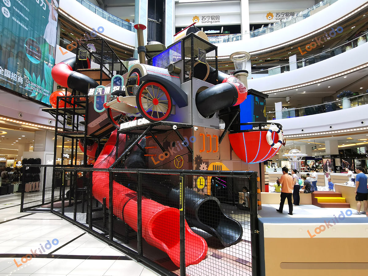 Real shot of retro steam train-shaped soft play playground
